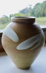 A vase with white glaze accent by David Collins