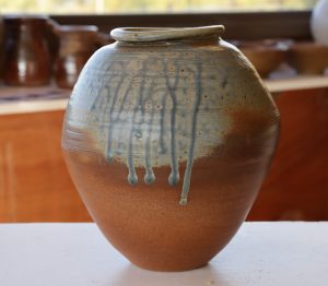 A Blue and brown vase made by David Collins