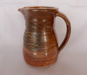 A medium Jug with a Shino created by David Collins
