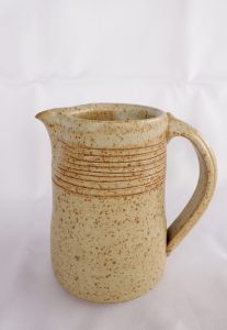 A medium Jug with a white carved Glaze created by David Collins