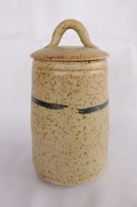 A Tea Caddy with a Blue and white line created by David Collins