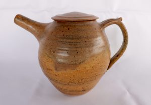 A Pottery Teapot with an oatmeal Magnesium glaze created by David Collins