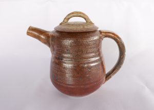 A small Pottery Teapot with a Shino glaze created by David Collins