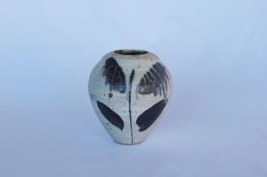 A Medium white Glazed Vase with blue leaves created By David Collins